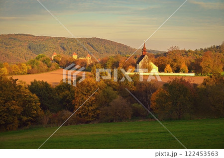 Beautiful autumn landscape with old Chapel of the Mother of God in Veveri. Sunset and beautiful blue sky with clouds. Colorful nature background on autumn season. Brno - Czech Republic. Beautiful autumn landscape with old Chapel of the Mother of God in Veveri. Sunset and beautiful blue sky with clouds. Colorful nature background on autumn season. Brno - Czech Republic. 122453563