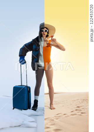 Traveler woman in winter jacket, hat, and gloves on one side, swimsuit and sunhat on other, pulling suitcase while sipping cocktail Traveler woman in winter jacket, hat, and gloves on one side, swimsuit and sunhat on other, pulling suitcase while sipping cocktail 122453720
