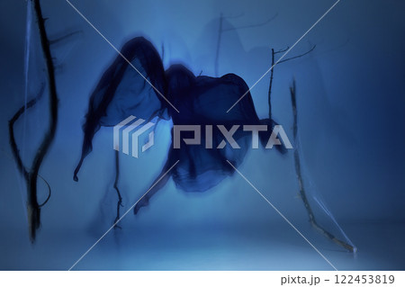 Phantom ballerina suspended in spectral glow, caught in ghostly like movement. Light and shadow blend elegance and mystique 122453819