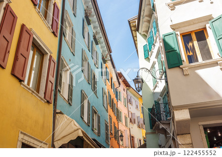 Colorfull buildings in a street of the Riva del Garda, town on the shores of Lake Garda, Italy, Europe. 122455552