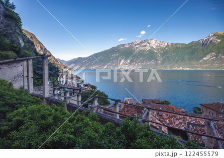 Lake Garda with mountains in background, view from Limone Sul Garda town, Italy, Europe. 122455579