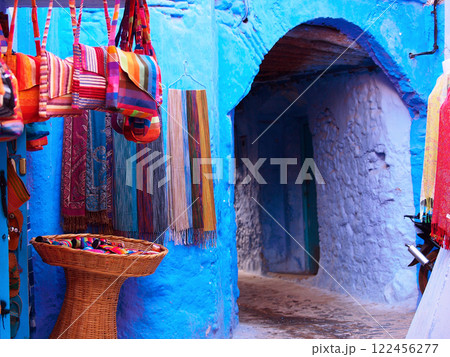 Blue Streets Of Chefchaouen In Morocco: A Serene And Picturesque Alleyway With Souvenirs For Sale Blue Streets Of Chefchaouen In Morocco: A Serene And Picturesque Alleyway With Souvenirs For Sale 122456277