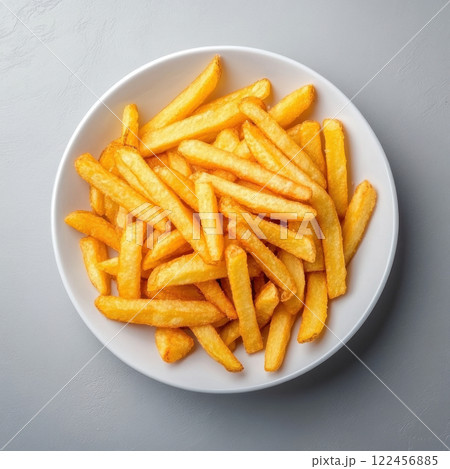 Crispy golden French fries served in a white bowl. isolated on white background. 122456885