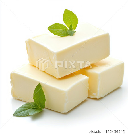 Fresh butter blocks garnished with mint leaves on a white background. isolated on white background. 122456945