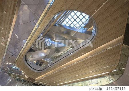 Jan 10 2025 Modern HK Shopping Mall Interior with Glass Balustrades 122457113