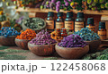 Wooden Bowls Filled With Colorful Dried Herbs And Flowers Surrounded By Essential Oil Bottles And Fresh Botanicals In A Rustic Apothecary Setting 122458068