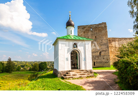 Orthodox Chapel of the Korsunskaya Icon of the Mother of God and Talav Tower of the medieval Izborsk fortress in summer, Izborsk, Pskov region, Russia Orthodox Chapel of the Korsunskaya Icon of the Mother of God and Talav Tower of the medieval Izborsk fortress in summer, Izborsk, Pskov region, Russia 122458309