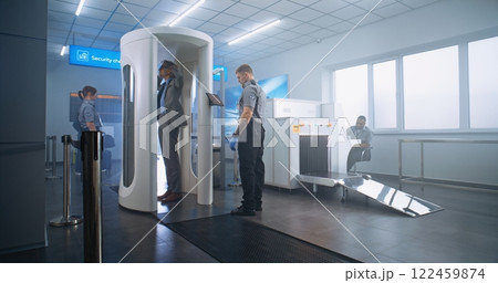 Airport Terminal: Mature Businessman Walks Through Metal Detector Scanner Gates 122459874