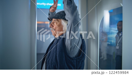 International Airport Terminal: Elderly Man Walks Through Metal Detector Scanner Gates 122459984