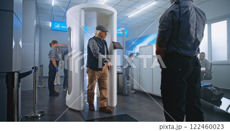 Airport Terminal Checkpoint: Diverse People Walking Through Metal Detector Gates 122460023