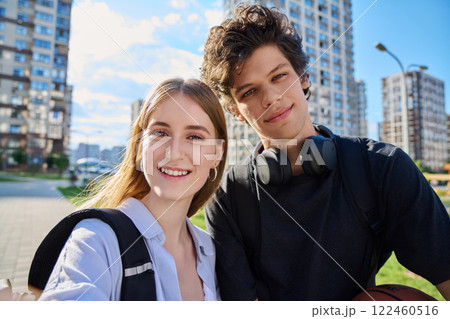 Selfie portrait of happy friends guy and girl college students looking at camera 122460516