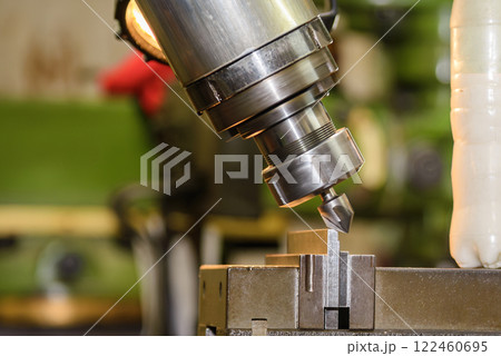 The angular milling process on NC milling machine with chamfer tools. 122460695