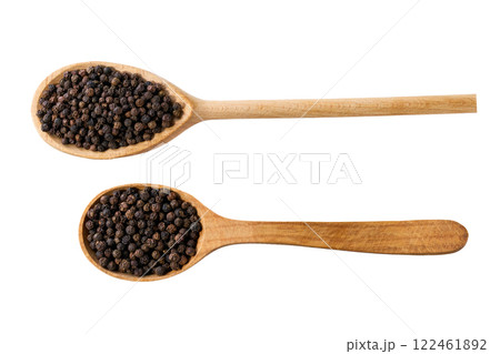 black peppercorns in a wooden serving scoop isolated on white background, top view. 122461892