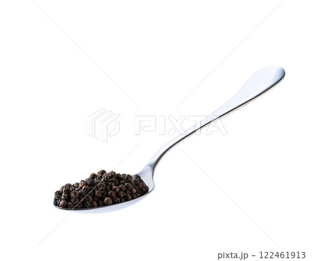 black peppercorns in a metal spoon isolated on white background. 122461913