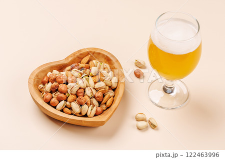 A vibrant assortment of various nuts and beer A vibrant assortment of various nuts and beer 122463996
