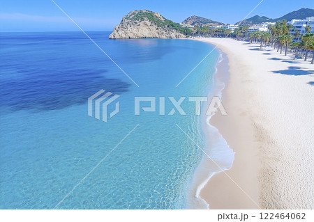 A beautiful beach with a blue ocean and a mountain in the background A beautiful beach with a blue ocean and a mountain in the background 122464062