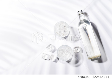 Crystal-clear glasses filled with chilled water and ice cubes Crystal-clear glasses filled with chilled water and ice cubes 122464254