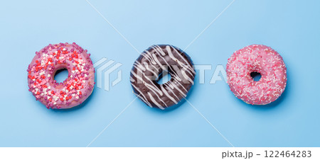 An assortment of vibrant donuts with colorful toppings 122464283