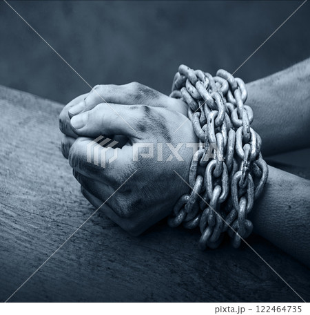Women's hands in iron chains 122464735