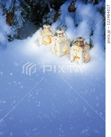 Lanterns in the snow under the Christmas tree Lanterns in the snow under the Christmas tree 122464817