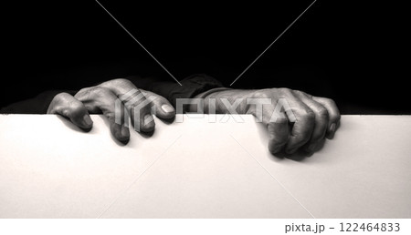 Old man hides after the wall Old man hides after the wall 122464833