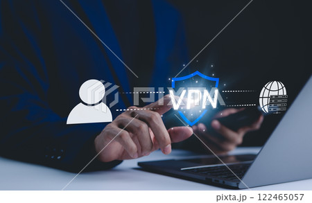 VPN, Virtual Private Network, Internet and network concept. A hand interacts with a digital interface displaying VPN technology, with icons representing secure internet connection and user privacy. VPN, Virtual Private Network, Internet and network concept. A hand interacts with a digital interface displaying VPN technology, with icons representing secure internet connection and user privacy. 122465057