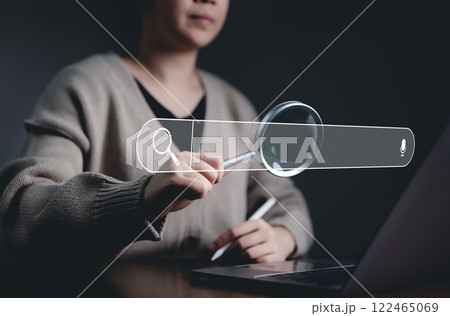 SEO search engine optimization concept. Search bar Interface, Woman using virtual search bar with magnifying glass icon, SEO and search engine optimization. Searching information on internet, 122465069