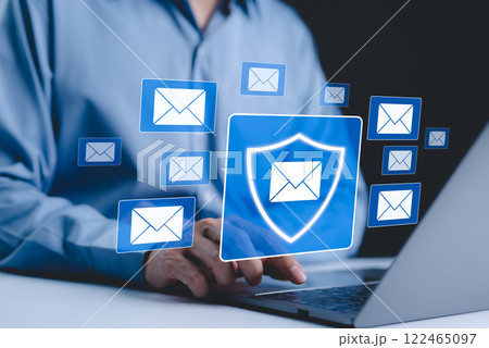 Email security and protection technology concept. A person uses laptop with virtual email protection icon. symbolizing secure communication, data privacy, cybersecurity in email systems. spam virus, Email security and protection technology concept. A person uses laptop with virtual email protection icon. symbolizing secure communication, data privacy, cybersecurity in email systems. spam virus, 122465097