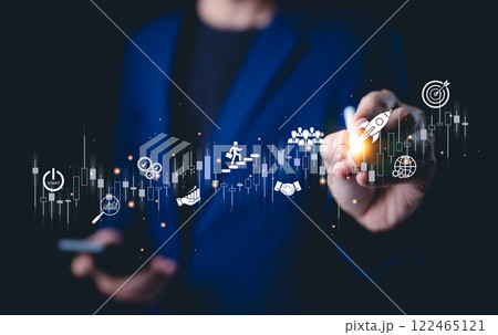 Business startup and investment goals concept. Businessman draws a graph with icons for business growth, startup initiatives, investment strategies, and market analysis. efforts and achieving goals. 122465121