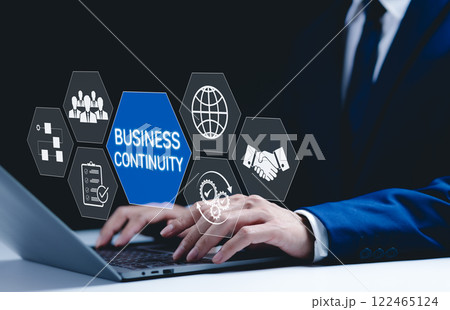 Business continuity and strategy concept. Businessman use laptop with digital icons represent business continuity, global operations, teamwork, workflow, and strategic planning in diverse conditions. 122465124
