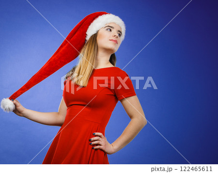 Woman wearing Santa Claus helper costume 122465611