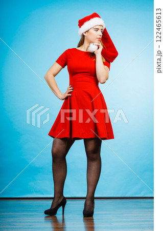Woman wearing Santa Claus helper costume dress Woman wearing Santa Claus helper costume dress 122465613