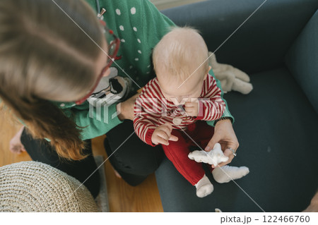 Delightful Cozy Moments The Wonderful Holiday Joy Shared Between Parent and Child Delightful Cozy Moments The Wonderful Holiday Joy Shared Between Parent and Child 122466760