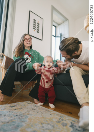 Enjoying Family Fun Cherished Holiday Moments with Baby in Our Cozy Living Room Space 122466782