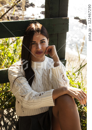 young pretty brunette woman on sea coast, lifestyle people concept young pretty brunette woman on sea coast, lifestyle people concept 122467290