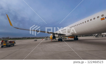 Airplane on the platform of Airport. Runway. Landing aircraft closeup.  122468523