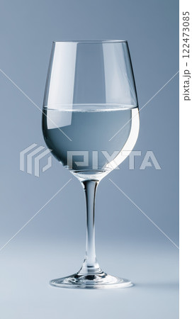 glass of clear water reflecting light and casting subtle shadows 122473085