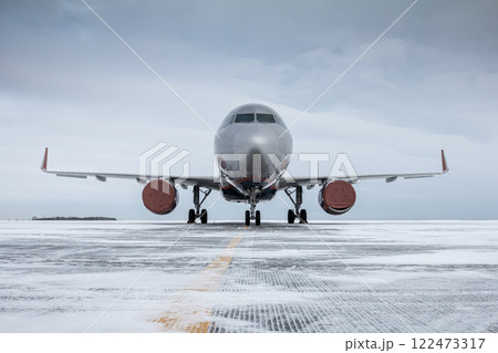 Passenger jetliner on the airport apron at winter 122473317