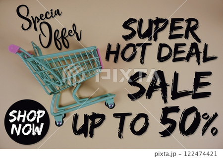 Super Hot Deal Sale 50% off Special Offer Promotion and trolley shopping cart on pink background 122474421