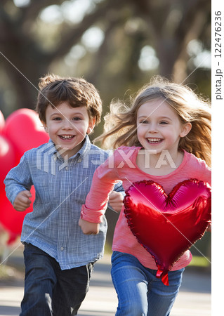 Children Running in Park with Valentine Themed Heart Balloons and Joyful Expressions 122476236
