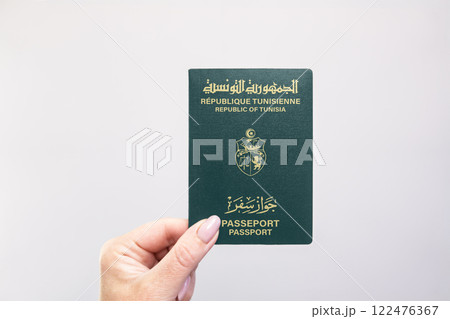 Passport Tunisia Held Against Simple White Background. Astana, Kazakhstan, 26 october 2024 Passport Tunisia Held Against Simple White Background. Astana, Kazakhstan, 26 october 2024 122476367