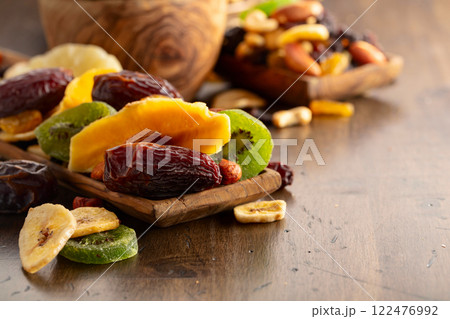 Dried tropical fruits with various nuts and raisins. Dried tropical fruits with various nuts and raisins. 122476992