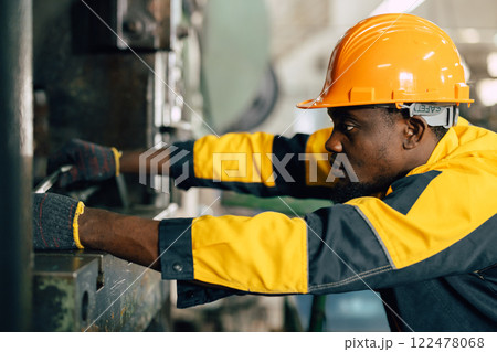 professional black african engineer team inspecting service machine in heavy industry factory professional black african engineer team inspecting service machine in heavy industry factory 122478068