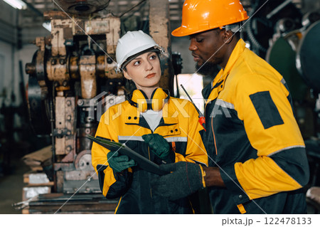 professional engineer team inspecting service machine in heavy industry factory professional engineer team inspecting service machine in heavy industry factory 122478133
