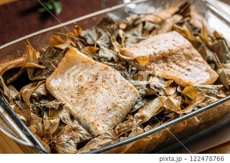 Closeup on portion of baked white fish 122478766