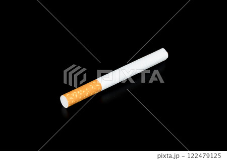 Cigarette butts isolated on black background Cigarette butts isolated on black background 122479125