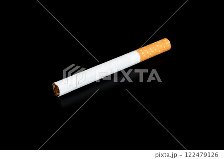Cigarette butts isolated on black background Cigarette butts isolated on black background 122479126