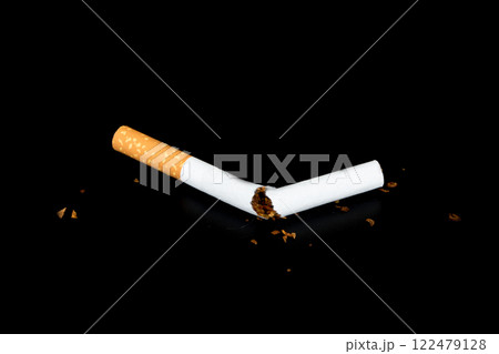 Cigarette butts isolated on black background Cigarette butts isolated on black background 122479128
