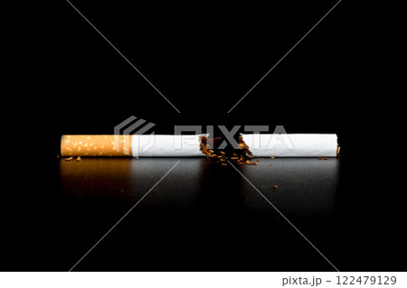 Cigarette butts isolated on black background 122479129