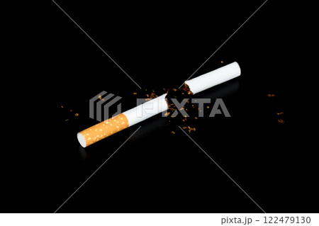Cigarette butts isolated on black background Cigarette butts isolated on black background 122479130